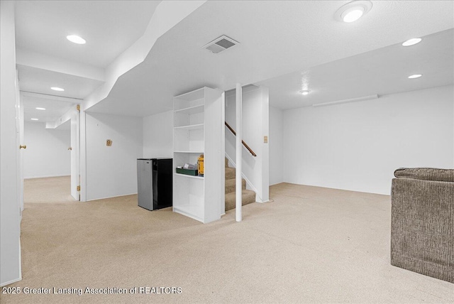 4538 Cranberry Ct, Lansing, MI 48917 - finished basement with carpet floors, recessed lighting, and stairway