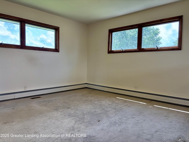 234 W Grand Ledge Hwy Unit R1, Mulliken, MI 48861 - carpeted empty room featuring plenty of natural light