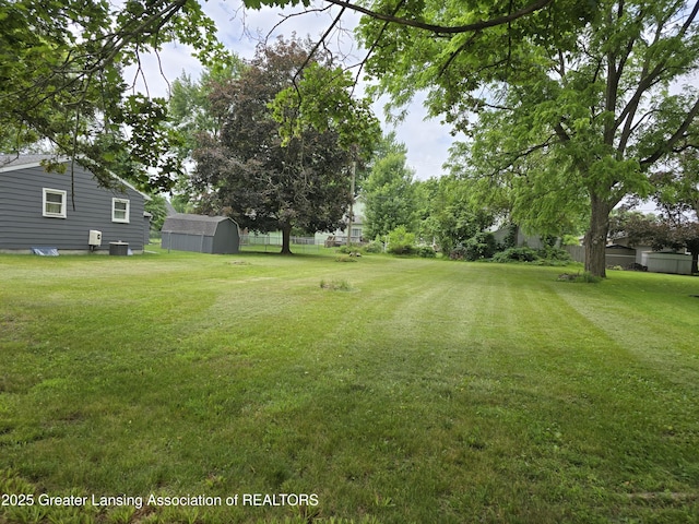 402 Crossman, Williamston, MI 48895 - view of yard featuring a storage shed