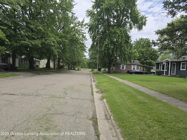 402 Crossman, Williamston, MI 48895 - view of asphalt street with curbs and sidewalks
