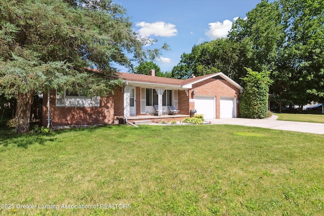 1117-1119 Blake Ave, Lansing, MI 48912 - single story home with covered porch, brick siding, a garage, driveway, and a front lawn