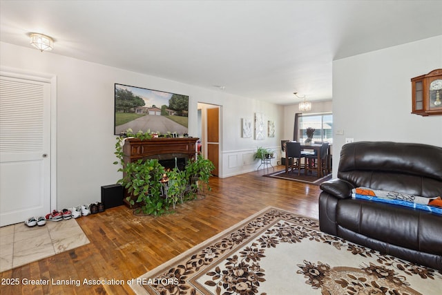 1117-1119 Blake Ave, Lansing, MI 48912 - living area featuring a chandelier and wood finished floors