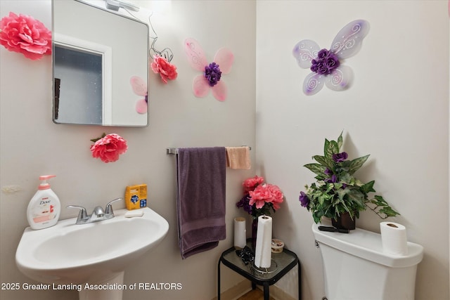 1117-1119 Blake Ave, Lansing, MI 48912 - half bath featuring a sink and toilet