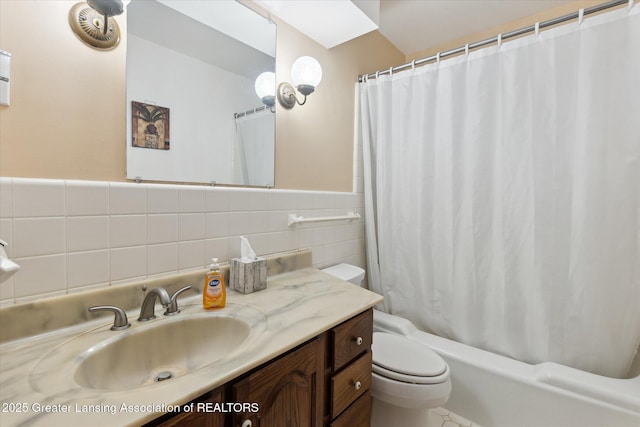 1117-1119 Blake Ave, Lansing, MI 48912 - bathroom with vanity, shower / bath combination with curtain, tile walls, and wainscoting