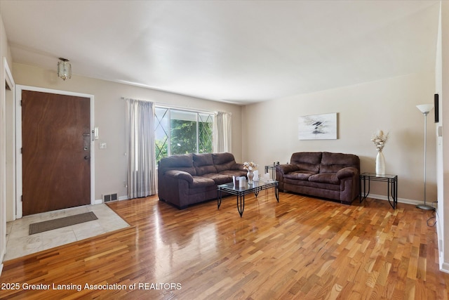 1117-1119 Blake Ave, Lansing, MI 48912 - living room with light wood-style floors and baseboards