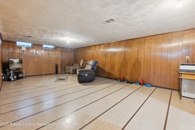 1117-1119 Blake Ave, Lansing, MI 48912 - unfurnished room featuring wooden walls and a textured ceiling