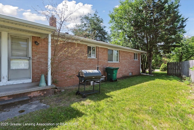 1117-1119 Blake Ave, Lansing, MI 48912 - rear view of house with brick siding and a chimney