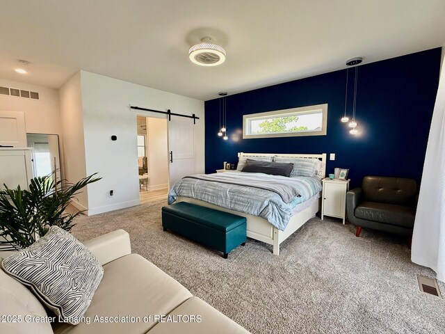 10993 Lakeside Dr, Perrinton, MI 48871 - carpeted bedroom with a barn door and baseboards
