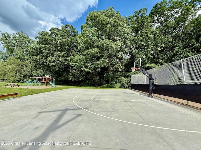 10993 Lakeside Dr, Perrinton, MI 48871 - view of basketball court featuring community basketball court and view of wooded area