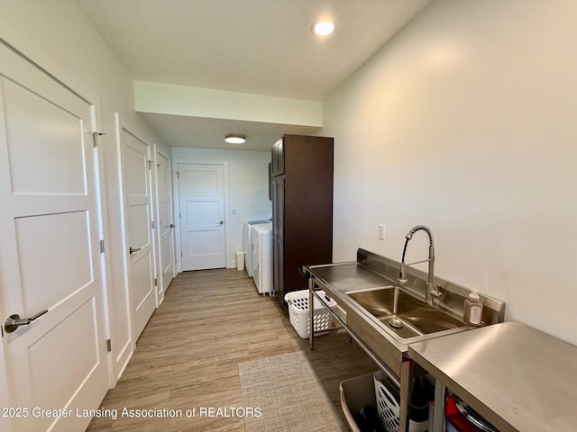10993 Lakeside Dr, Perrinton, MI 48871 - kitchen with light wood finished floors, washer / dryer, and recessed lighting