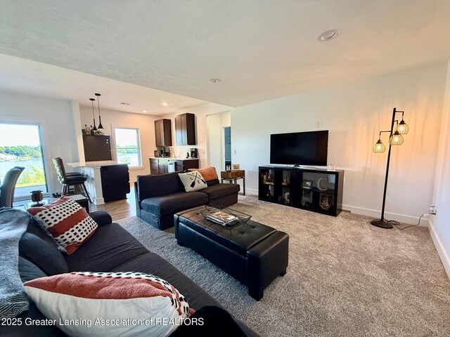 10993 Lakeside Dr, Perrinton, MI 48871 - living room with light colored carpet and recessed lighting