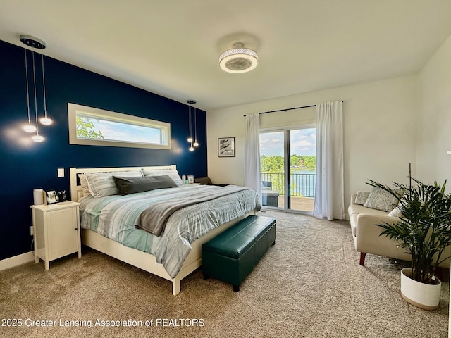 10993 Lakeside Dr, Perrinton, MI 48871 - carpeted bedroom featuring access to outside and multiple windows