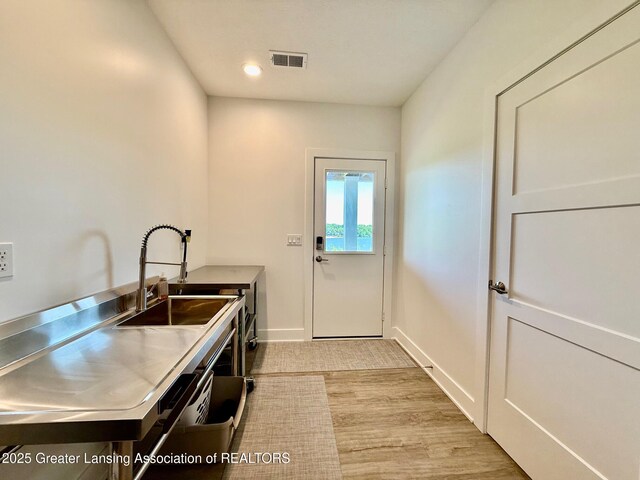 10993 Lakeside Dr, Perrinton, MI 48871 - laundry area featuring recessed lighting and light carpet