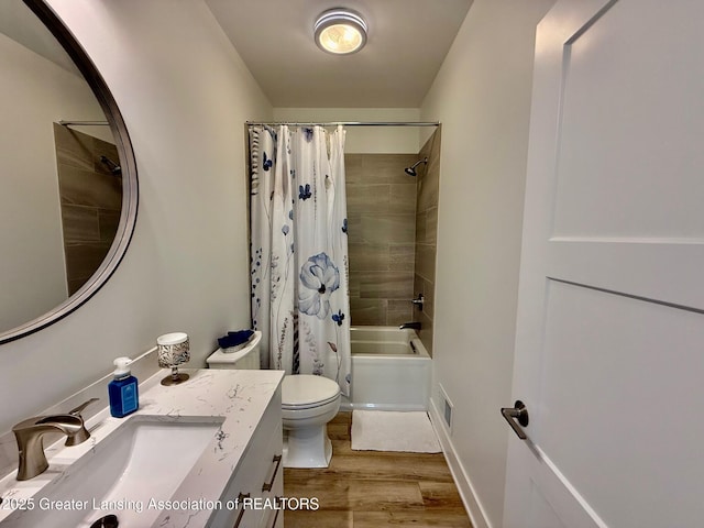 10993 Lakeside Dr, Perrinton, MI 48871 - full bath featuring vanity, wood finished floors, and shower / tub combo with curtain