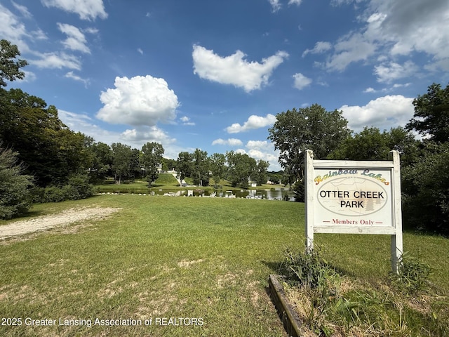 10993 Lakeside Dr, Perrinton, MI 48871 - surrounding community featuring a water view and a yard