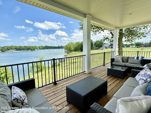 10993 Lakeside Dr, Perrinton, MI 48871 - wooden deck featuring outdoor lounge area, a water view, and a yard