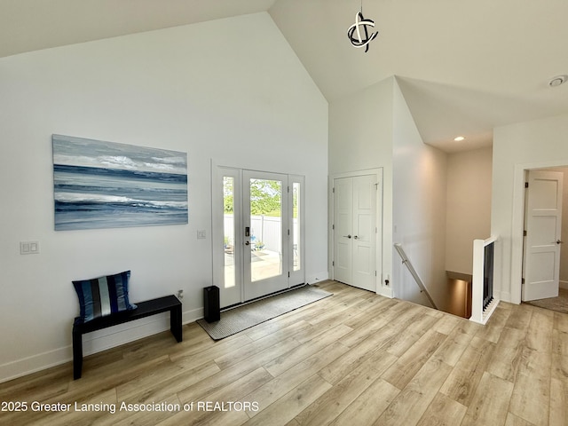 10993 Lakeside Dr, Perrinton, MI 48871 - foyer with high vaulted ceiling, wood finished floors, french doors, and recessed lighting