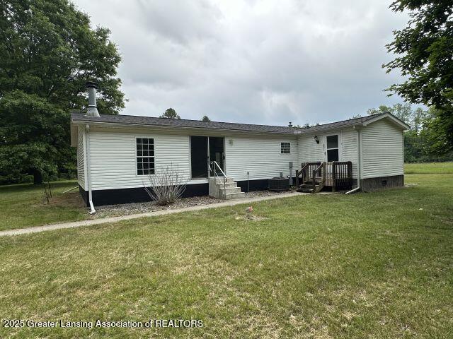8241 Barson Rd, Rives Junction, MI 49277 - back of house with a lawn, entry steps, and crawl space