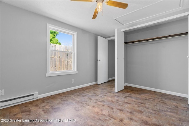 1116 Cooper Ave, Lansing, MI 48910 - unfurnished bedroom featuring attic access, a baseboard heating unit, wood finished floors, a closet, and a ceiling fan