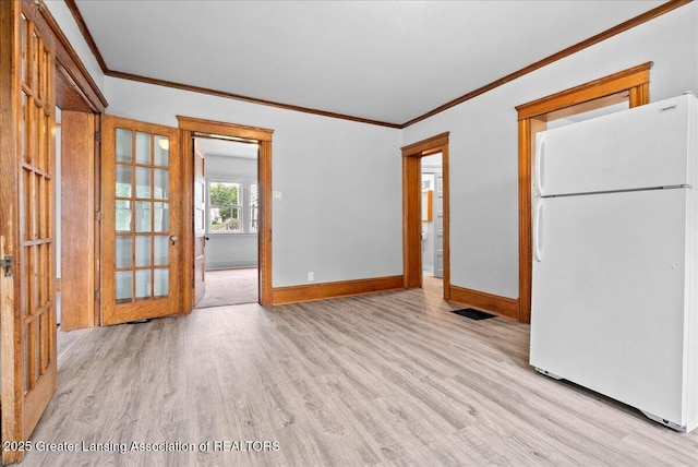 916 Wildwood Ave, Jackson, MI 49202 - spare room with ornamental molding and light wood-type flooring