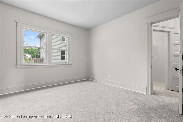 916 Wildwood Ave, Jackson, MI 49202 - carpeted spare room featuring crown molding