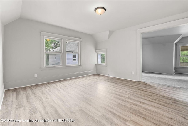 916 Wildwood Ave, Jackson, MI 49202 - bonus room featuring vaulted ceiling and wood finished floors