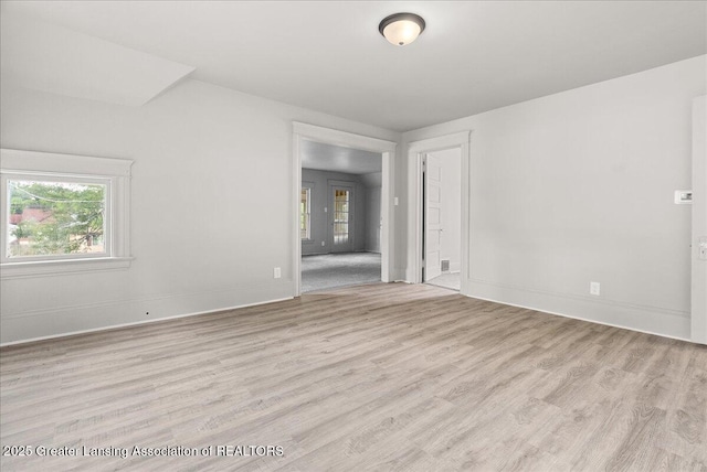 916 Wildwood Ave, Jackson, MI 49202 - spare room featuring wood finished floors and baseboards