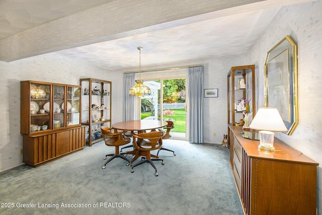 1809 S Holly Way, Lansing, MI 48910 - dining space with carpet flooring and a chandelier