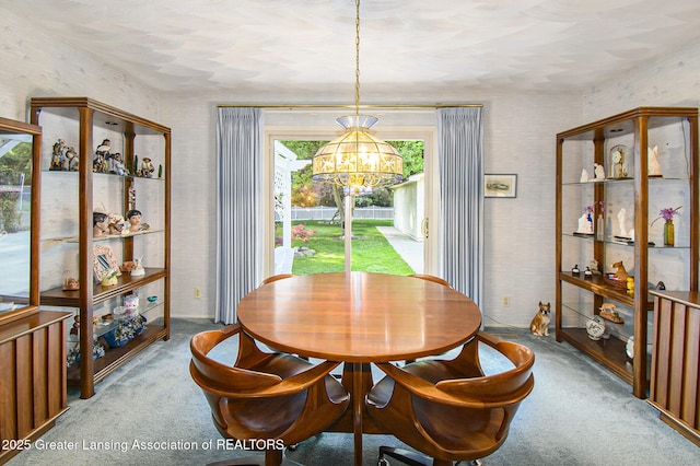 1809 S Holly Way, Lansing, MI 48910 - carpeted dining space with a chandelier