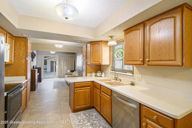 1809 S Holly Way, Lansing, MI 48910 - kitchen with appliances with stainless steel finishes, a textured ceiling, light countertops, brown cabinets, and light tile patterned floors