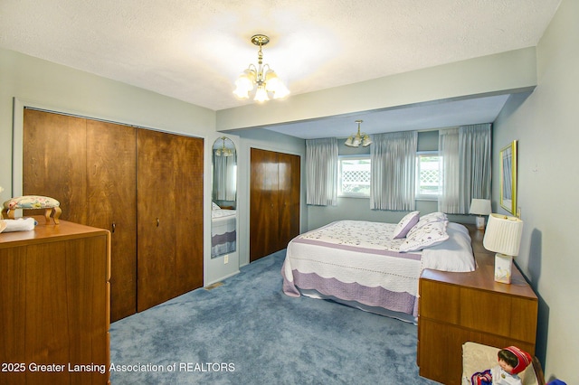1809 S Holly Way, Lansing, MI 48910 - bedroom featuring carpet flooring, a chandelier, and a textured ceiling