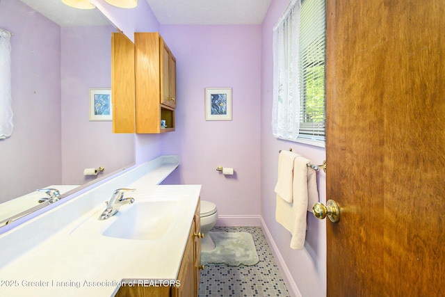 1809 S Holly Way, Lansing, MI 48910 - bathroom with vanity and baseboards