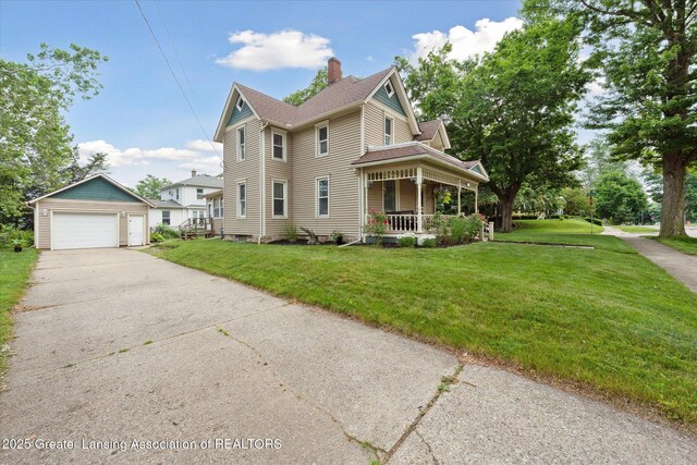 409 E Higham St, Saint Johns, MI 48879 - view of front facade with an outdoor structure, a porch, a chimney, a garage, and a front yard
