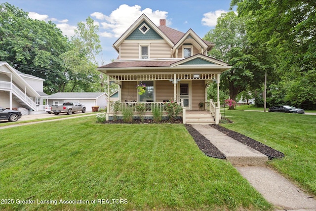409 E Higham St, Saint Johns, MI 48879 - victorian house featuring a porch, a front lawn, and roof with shingles