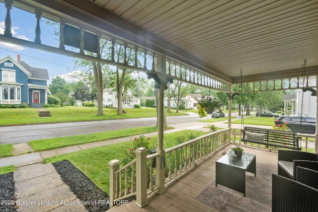 409 E Higham St, Saint Johns, MI 48879 - porch with a lawn and a residential view