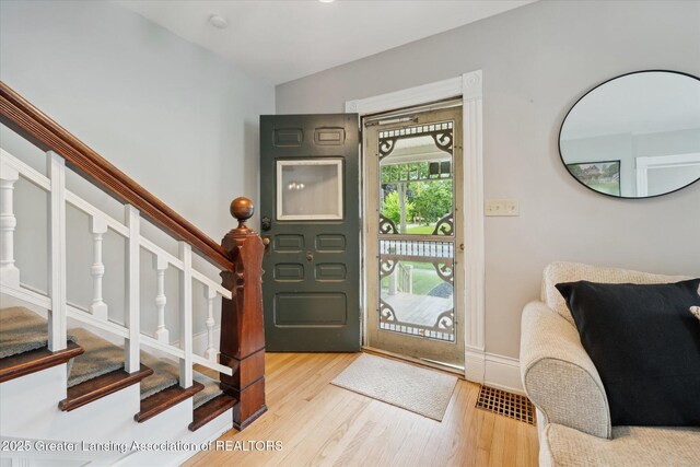 409 E Higham St, Saint Johns, MI 48879 - entryway with stairway and light wood-type flooring