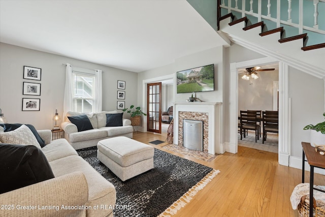 409 E Higham St, Saint Johns, MI 48879 - living room with light wood-type flooring and a fireplace