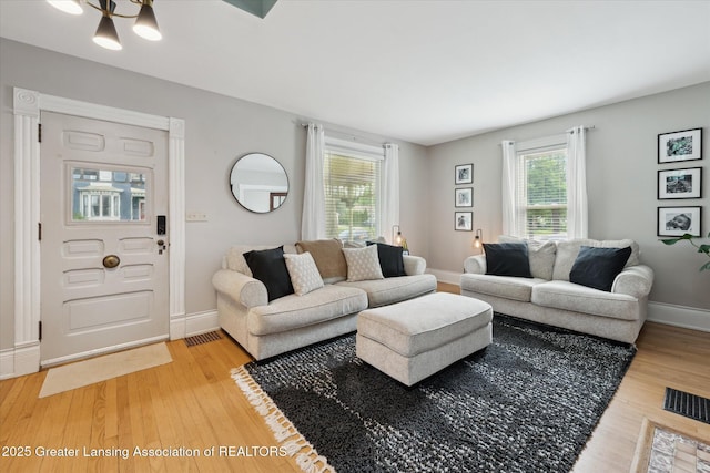 409 E Higham St, Saint Johns, MI 48879 - living room with light wood finished floors and baseboards
