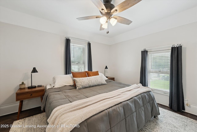 409 E Higham St, Saint Johns, MI 48879 - bedroom featuring wood finished floors, multiple windows, and ceiling fan