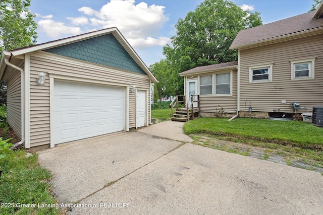 409 E Higham St, Saint Johns, MI 48879 - detached garage featuring driveway