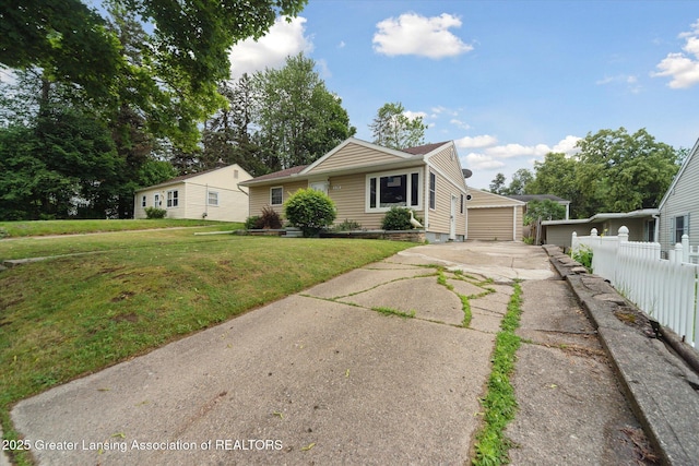 536 Hunter Blvd, Lansing, MI 48910 - view of front of home with an outdoor structure and a garage