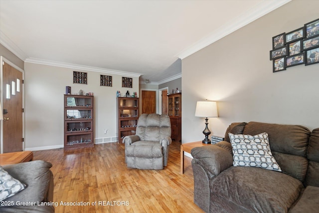536 Hunter Blvd, Lansing, MI 48910 - living room featuring light wood-type flooring and crown molding