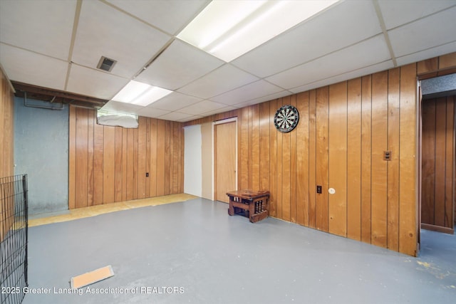 536 Hunter Blvd, Lansing, MI 48910 - finished basement with wood walls and a paneled ceiling