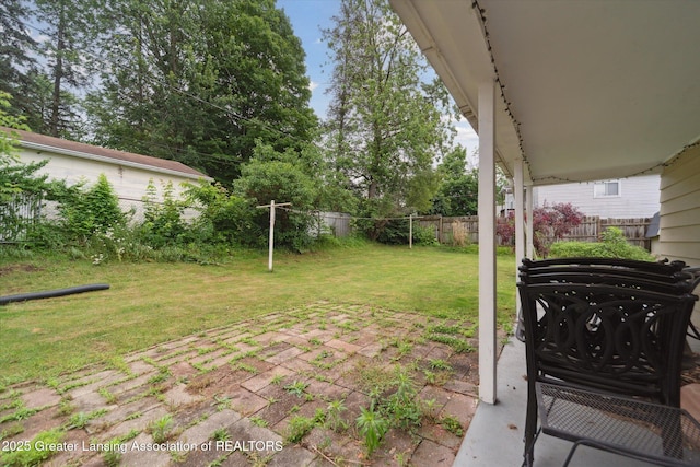 536 Hunter Blvd, Lansing, MI 48910 - fenced backyard featuring a patio area