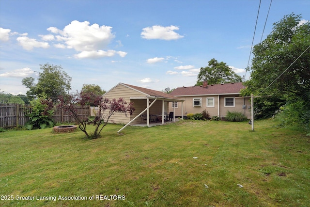 536 Hunter Blvd, Lansing, MI 48910 - back of property with a fire pit and a patio