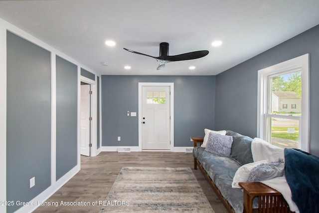 304 W Gibbs St, Saint Johns, MI 48879 - living area with healthy amount of natural light, ceiling fan, wood finished floors, and recessed lighting