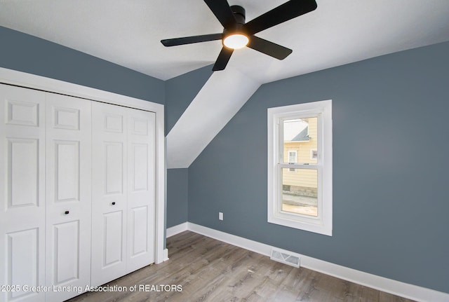 304 W Gibbs St, Saint Johns, MI 48879 - bonus room with a ceiling fan, vaulted ceiling, and wood finished floors