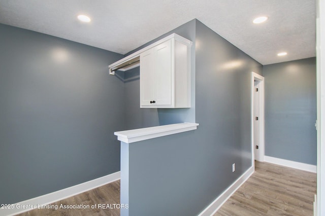 304 W Gibbs St, Saint Johns, MI 48879 - corridor with light wood-style flooring and recessed lighting