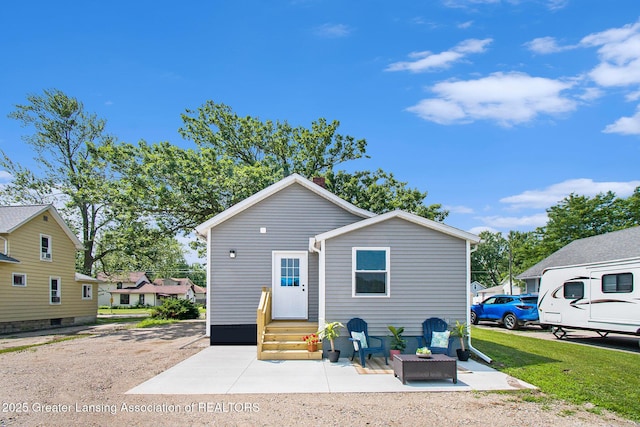 304 W Gibbs St, Saint Johns, MI 48879 - back of house with entry steps and a patio