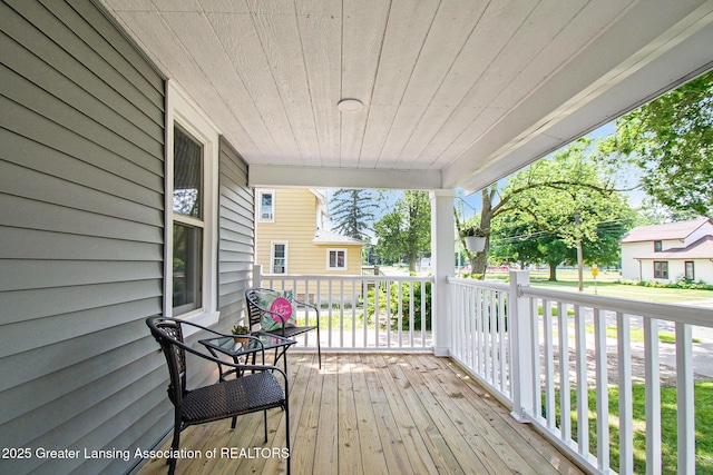 304 W Gibbs St, Saint Johns, MI 48879 - view of wooden porch